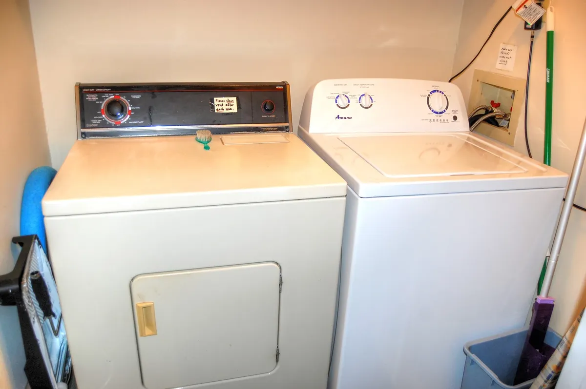 This image captures a dedicated laundry area featuring a washer and dryer set. The appliances are neatly positioned, conveying a sense of convenience and efficiency for everyday chores.